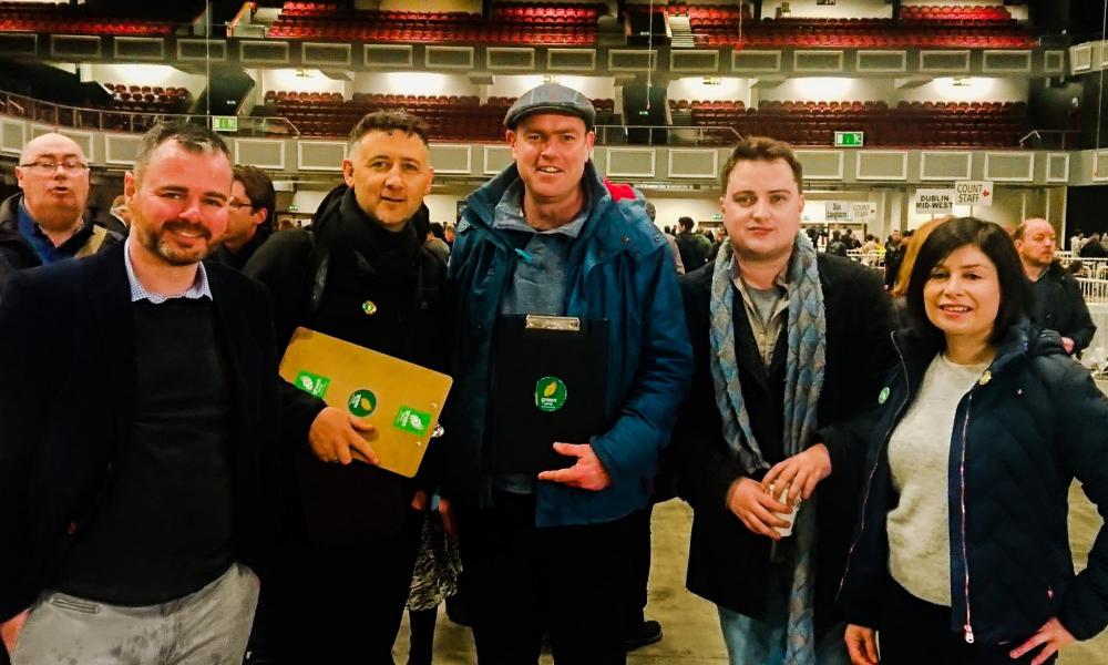 Francis N. Duffy, TD for Dublin South West, is surrounded by Green Party volunteers at the General Election count in 2020