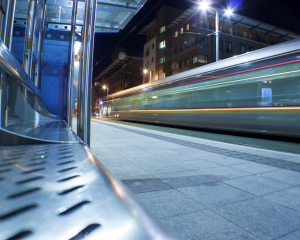 A Luas tram goes past a station in Dublin.