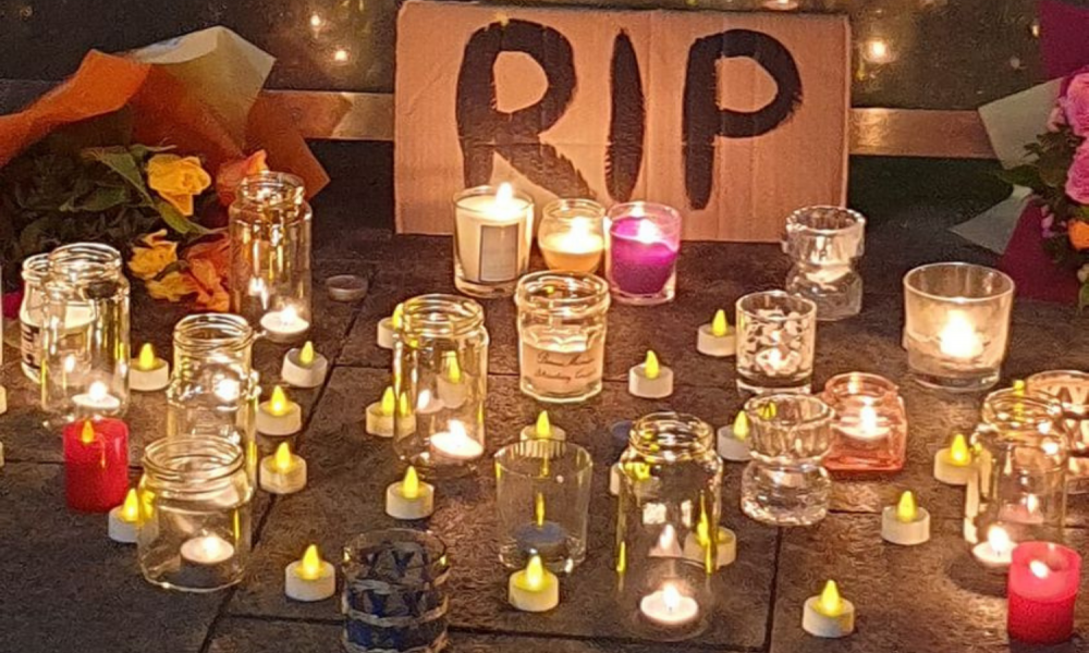 Candles, flowers and signs left at a vigil for Ashling Murphy in January 2022