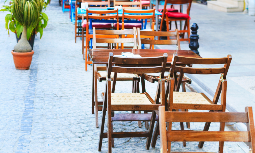 Tables and chairs on the street outside a cafe or restaurant for outdoor dining