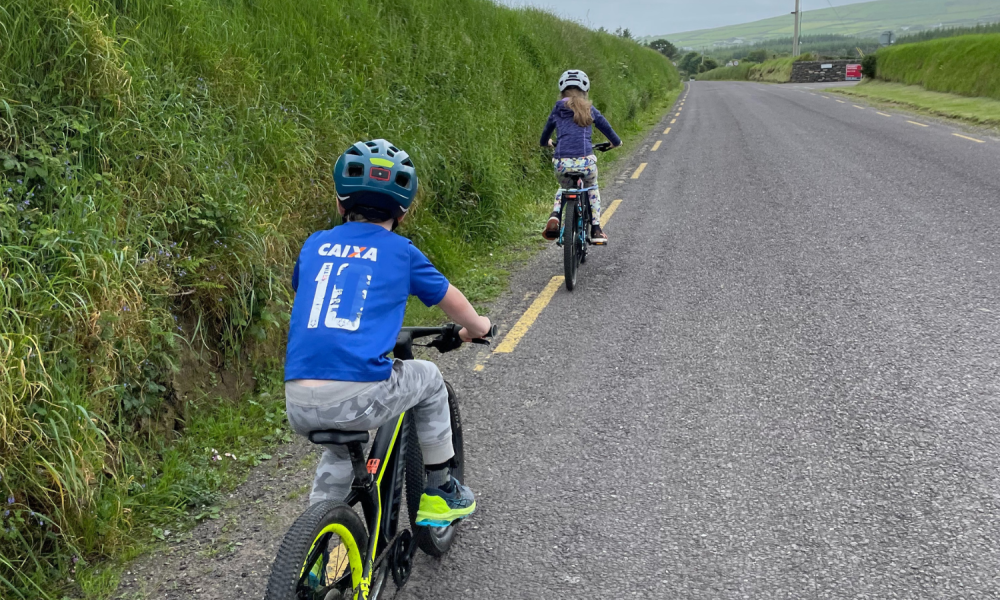 Children cycle down a country road, Co Kerry