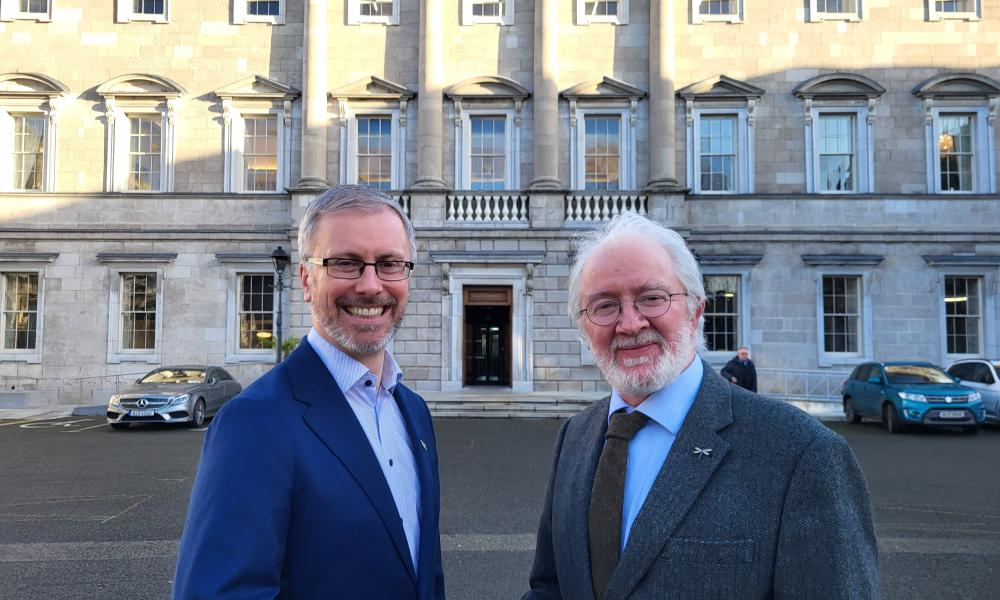 Roderic O'Gorman congratulates newly elected Senator Malcolm Noonan outside Leinster House