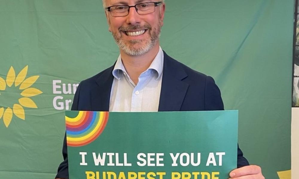 Roderic holding sign saying I 'I will see you at Budapest Pride'