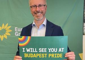 Roderic holding sign saying I 'I will see you at Budapest Pride'