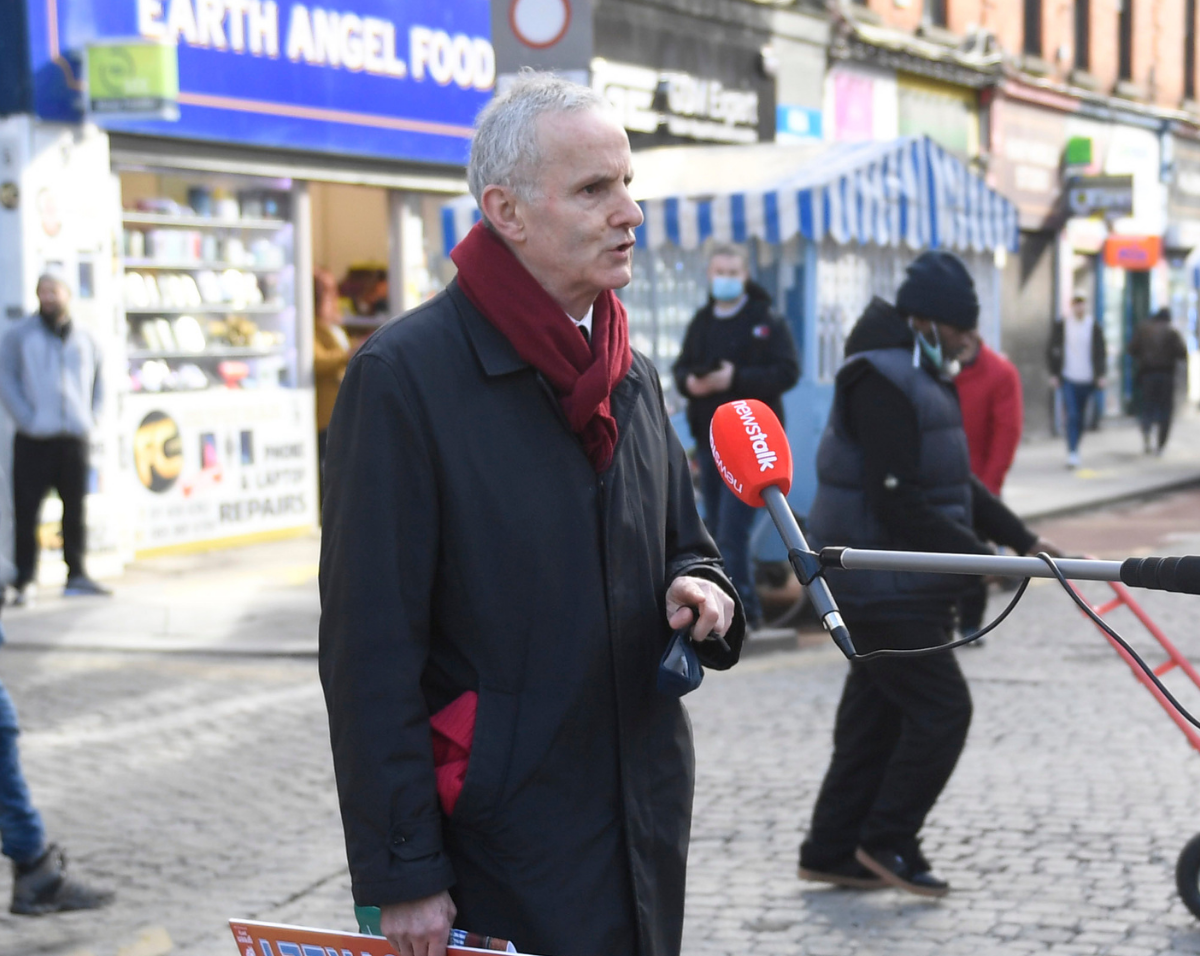 Ciaán Cuffe speaks to a journalist on Moore Street, Dublin